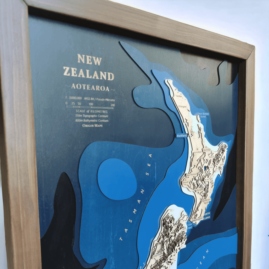 Close up of a new zealand map featuring the legend which reads new zealand, aotearoa