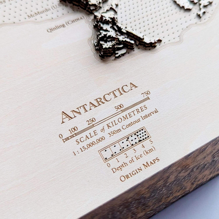 Map of Antarctica with scale and contour interval details on a textured surface.