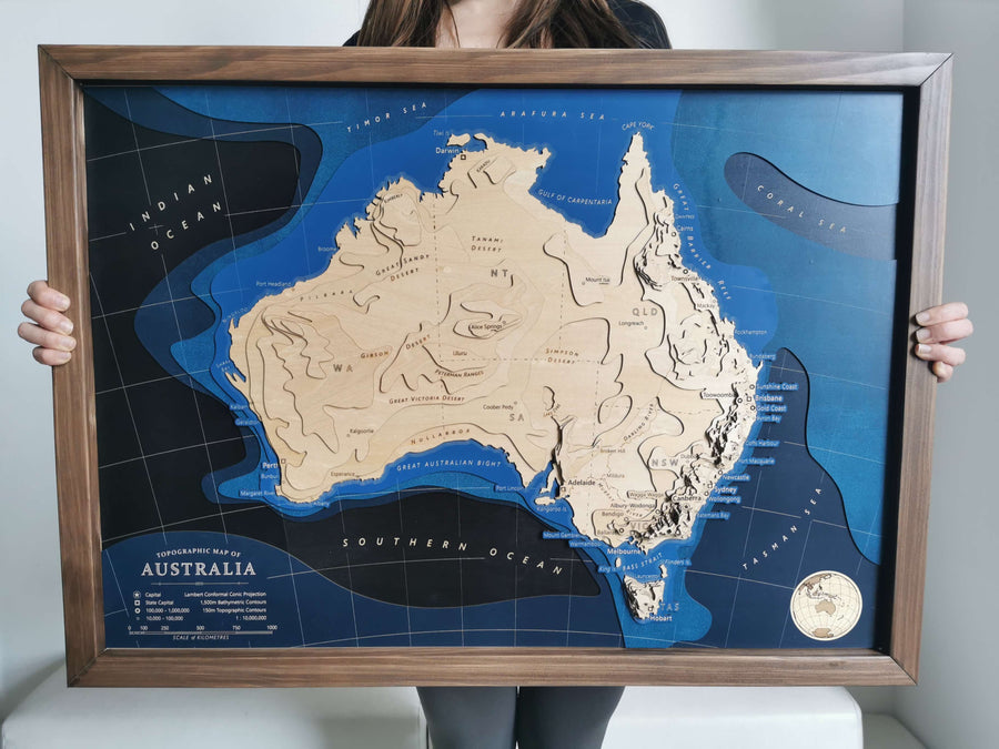 Australia Wooden topographic contour map art framed held by a girl