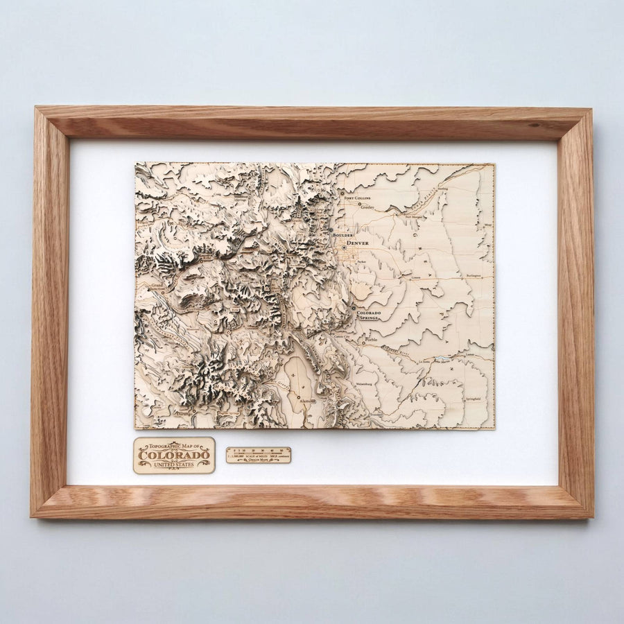 Colorado wooden map art in an oak frame, a carved 3D topographic map