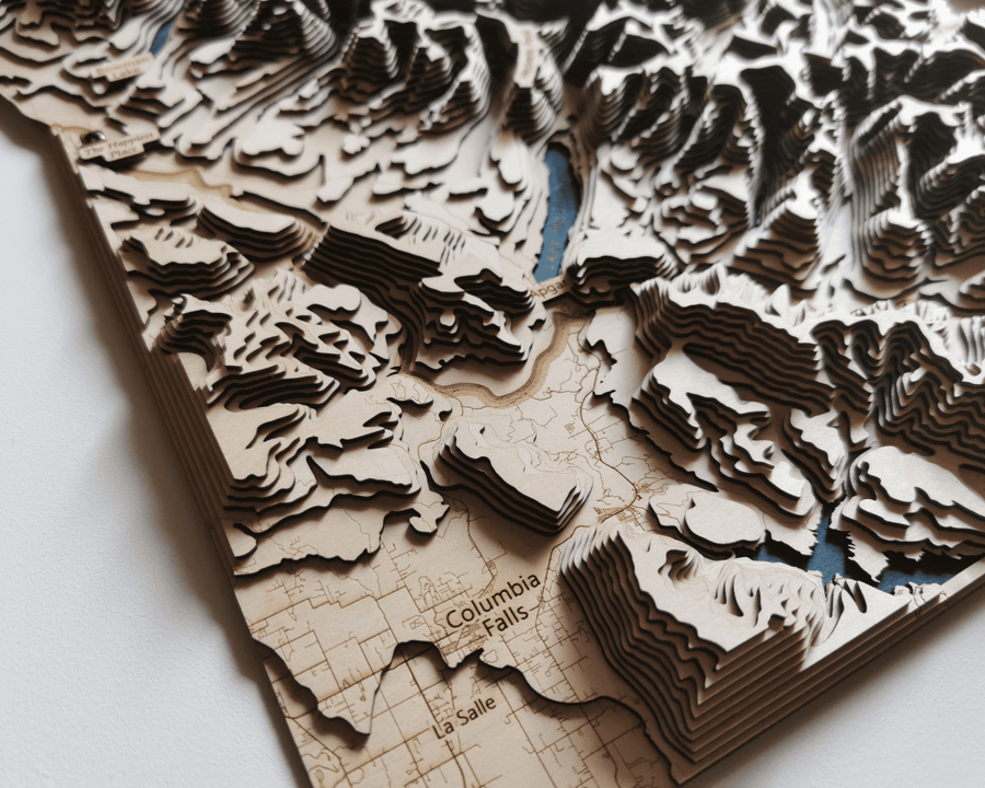 wooden map of columbia falls of montana usa. It features the contours of nearby mountains of glacier national park