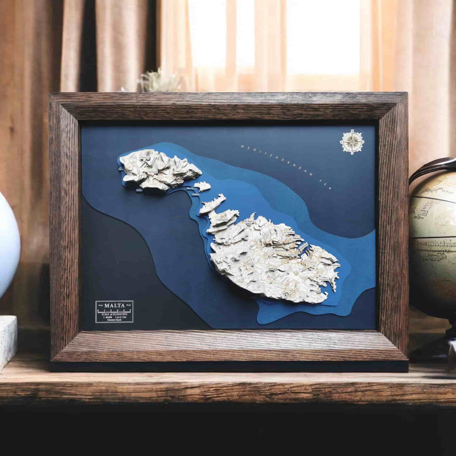 Bespoke Wooden Framed Map art of Malta sitting on a desk