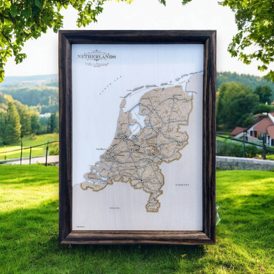 Wooden Laser cut relief map of the netherlands, with rolling dutch hills in the background