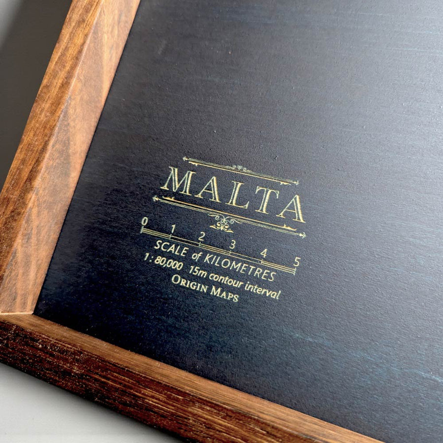 Dark blue map of Malta with wooden frame
