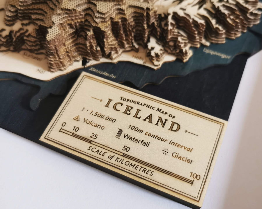 closeup of a map legend of a wooden map of iceland