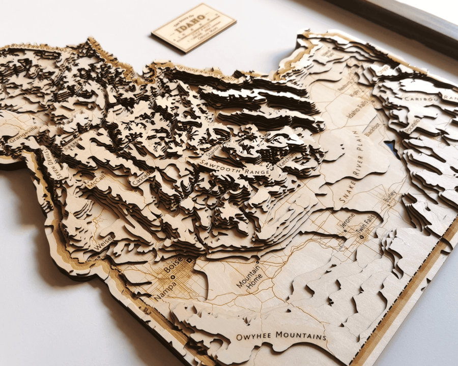 Wooden 3d topographic contour map art of idaho state, featuring sawtooth range and snake river plain