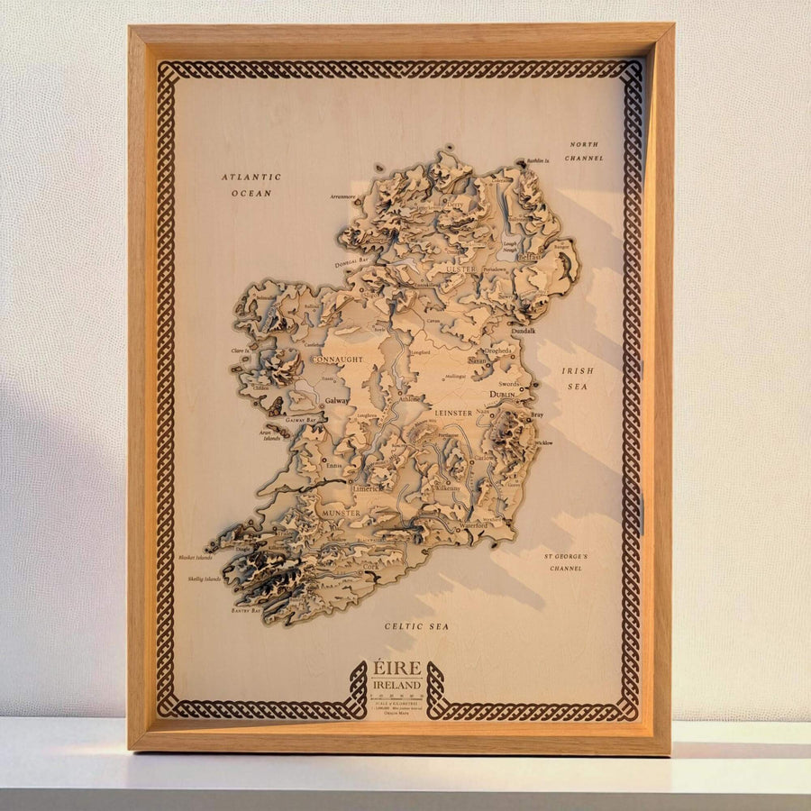 Framed map of Ireland with wooden border on a white background