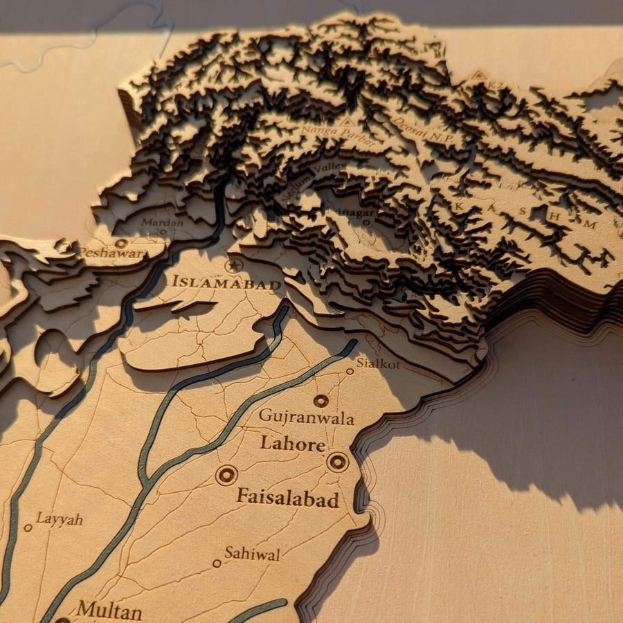 Wooden relief map of Pakistan with cities labeled