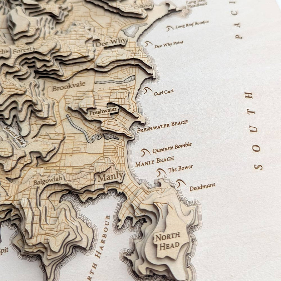 Freshwater Beach and Manly Beach as seen on a wooden contour map of The northern beaches