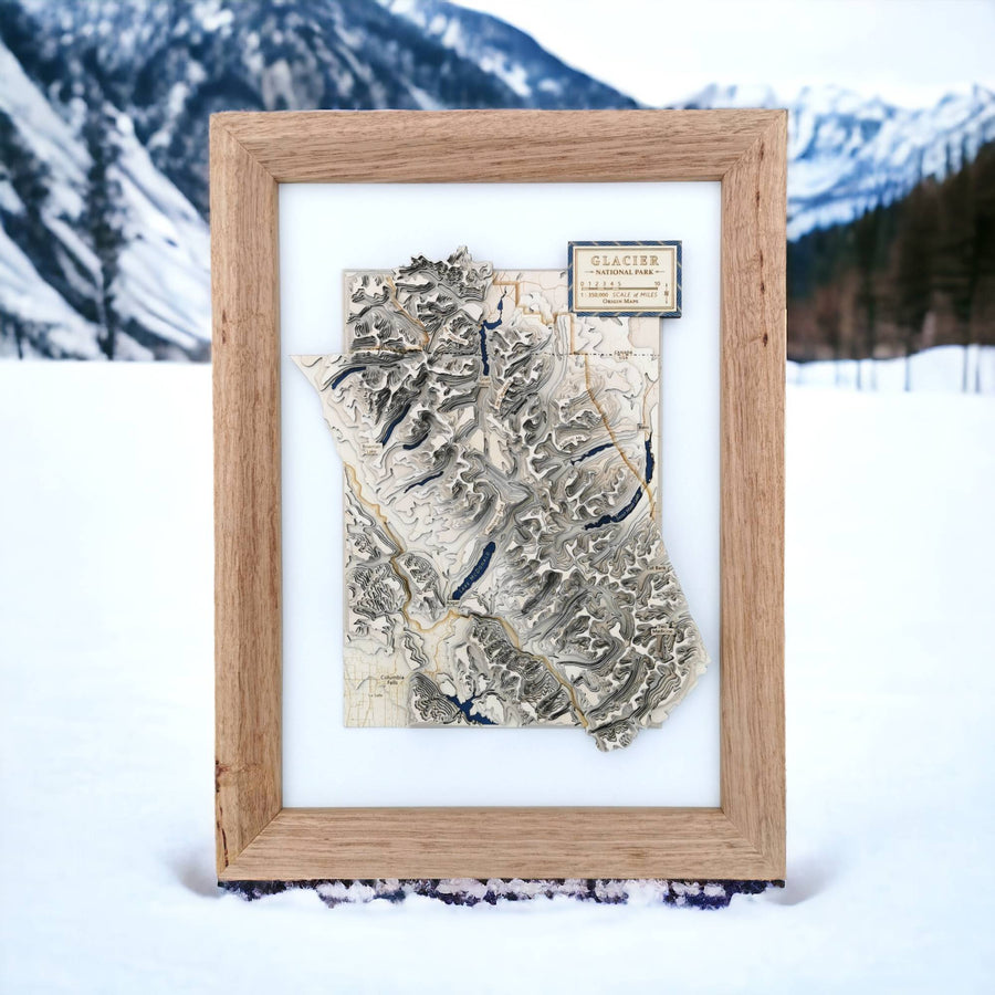 A topographic wooden contour map of Glacier National Park Montana, it features a natural wood frame