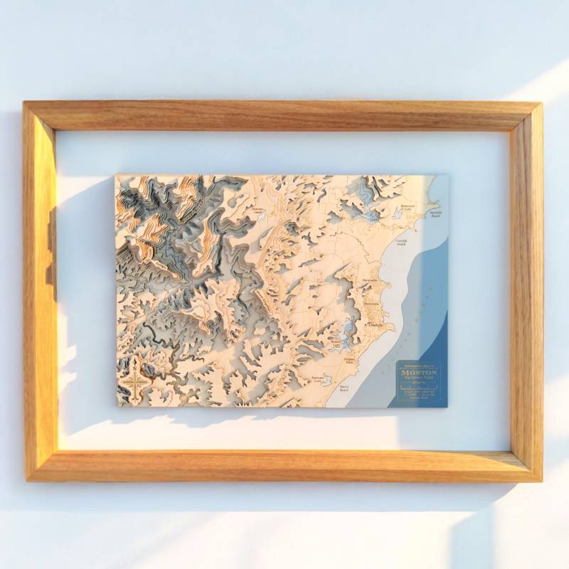 Contour map art of morton national park and ulladulla in a light wooden frame