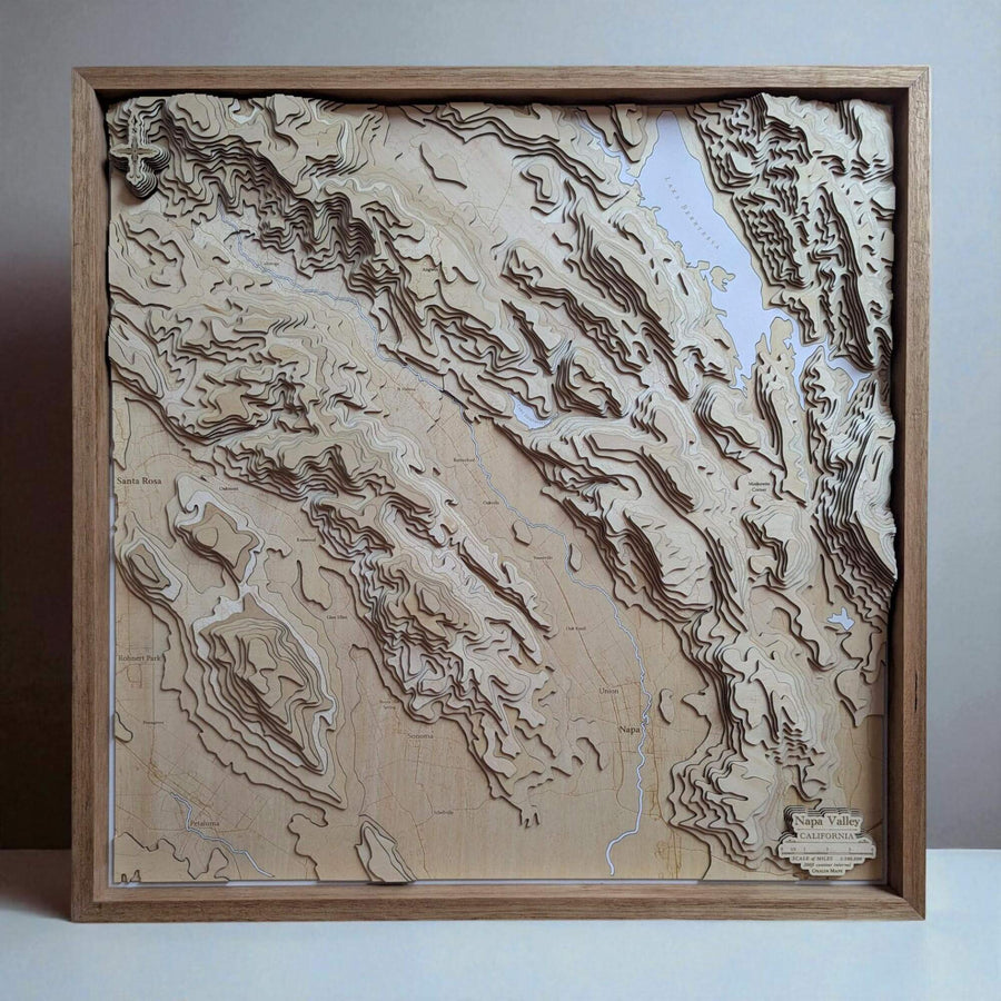 Wooden topographic map of a mountainous region of Napa Valley in a wooden frame.