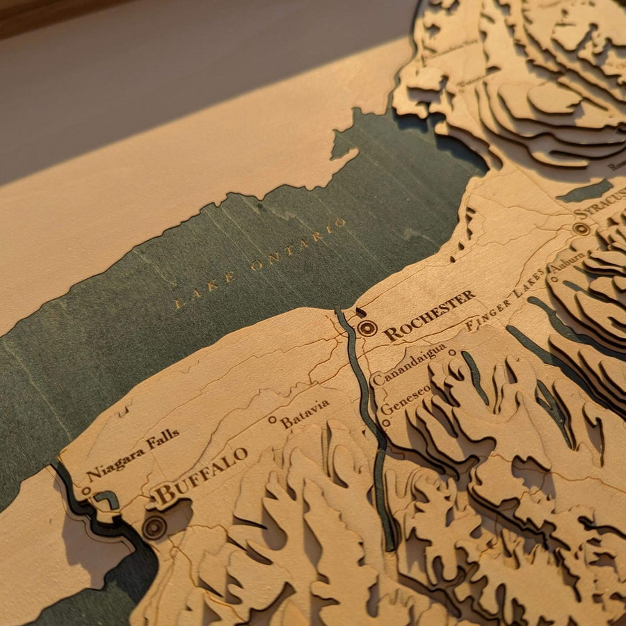 Wooden topographic map of the northeastern United States with labeled cities.