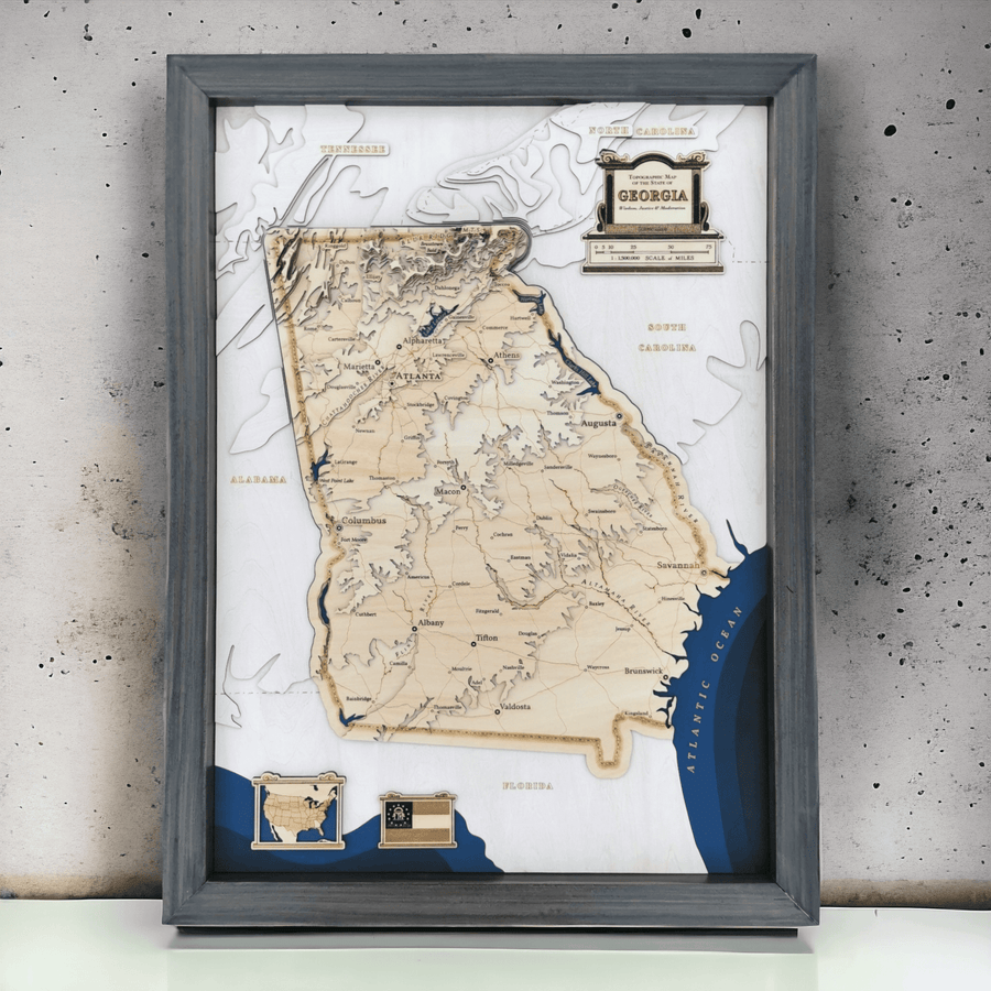 A framed wooden contour map of the USA state of Georgia, it features the capital Atlanta and other famous locations