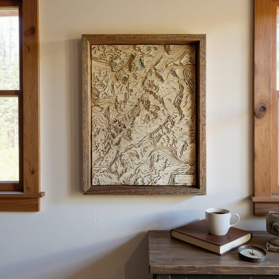 Framed Wooden Map Art on a bedroom wall. Map is of the Tour du Mont Blanc (TMB)