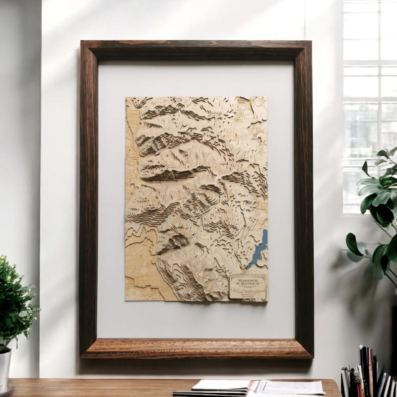 Wasatch Mountain Range Utah as a topographic wooden map in a frame on a desk